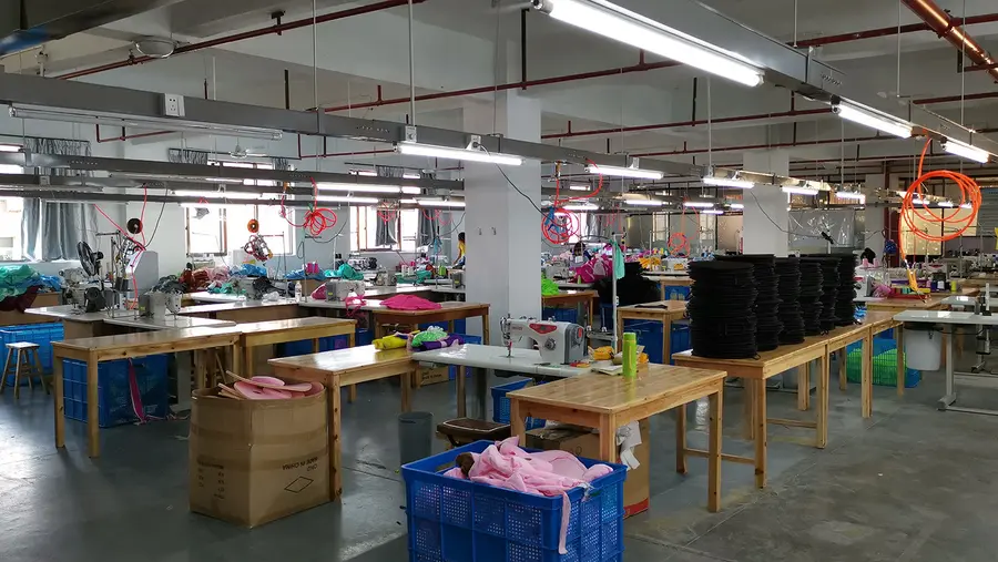 Collapsible stool production room with seat components at Locyop factory Yiwu
