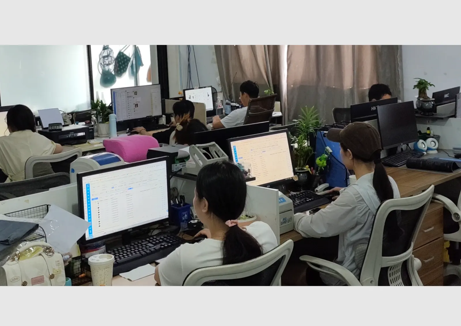 Locyop sales and order processing team working at the collapsible stool factory office in Yiwu China